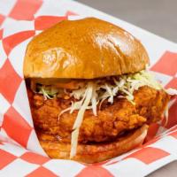 Nashville Hot Sando · Nashville hot fried chicken topped with comeback sauce and vinegar slaw and pickles. (Spicy ...