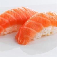 Scottish Salmon Nigiri · 2 pieces. Scottish, sushi rice topped with slices of raw fish.