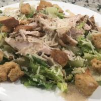Chicken Caesar Salad · Romaine lettuce, shredded Parmesan cheese and croutons tossed in Caesar dressing.