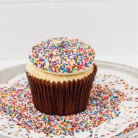 Birthday Cake Cupcake · Our vanilla funfetti cake topped with vanilla buttercream and dipped in festive birthday spr...