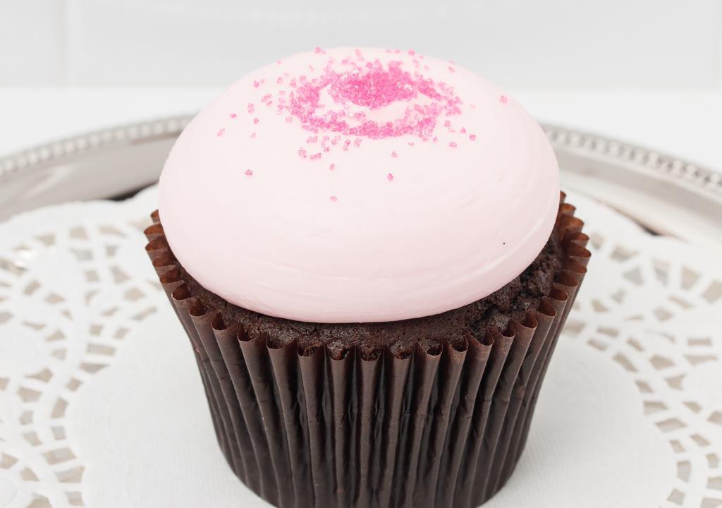 Tiffy'S  Chocolate Cupcake · Our moist chocolate cake topped with pretty pink vanilla buttercream swirl and pink sanding sugar.