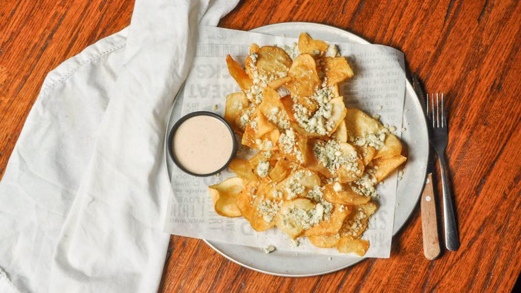 Buff Chips · Topped with bleu cheese crumbles & southwest ranch for dipping. Make them saucy and get them tossed in hot sauce with melted bleu cheese crumbles and a ranch dressing drizzle.