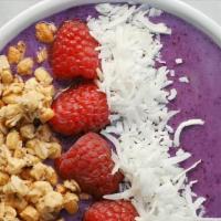 Wild Blueberry Bowl · Blended: apple juice, greek yogurt, blueberries, banana, coconut flakes and chia seeds, topp...