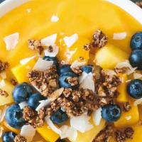Mango Sunrise Bowl · Blended: milk (your choice), greek yogurt, mango, banana, coconut flakes and turmeric powder...