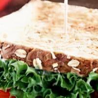 Turkey Sandwich · Choose of Bread (Multigrain, Keto, Nopal), Turkey, Panela Cheese, Mayo, Avocado, Lettuce, To...