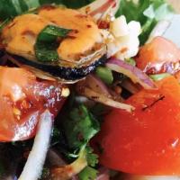 Spicy Seafood Salad · Spicy. Combination of seafood with sliced cucumber, tomatoes, onions and cilantro tossed wit...