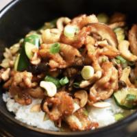 Lunch / Cashew Chicken Bowl · Wok tossed chicken with zucchini, mushrooms, and cashew nuts over steamed rice.