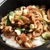 Cashew Chicken Bowl · Wok tossed chicken with zucchini, mushrooms, and cashew nuts over steamed rice.