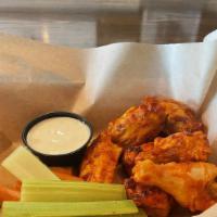 Baked Buffalo Wings · 8 Brick Oven baked chicken wings with ranch or blue cheese dressing