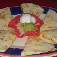 Poblano Quesadilla · Melted jack and cheddar cheese, roasted poblano peppers, and pico de gallo between two flour...