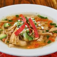 Chicken Tortilla Soup · Homemade chicken broth and grilled chicken with fresh avocado, cilantro, green onion, choppe...