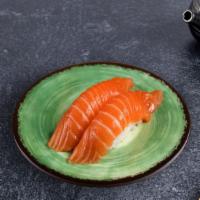 Tuna Nigiri · Slice of tuna fish over rice. (2 pieces).