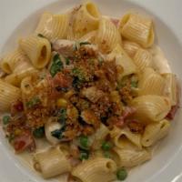 Rigatoni Con Pollo Lunch · Sliced grilled chicken, roasted corn, peas, tomatoes, and rigatoni pasta tossed with a white...