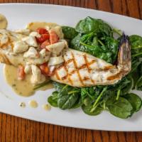 Branzino Con Spinaci E Granchio Lunch · Grilled Mediterranean sea bass topped with a white wine lemon capers and jumbo lump crabmeat...