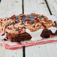 Miss Mazy’S Mud Pie · Rich fudge brownie topped with decadent whipped cream, rich mocha frosting, toasty pecans & ...