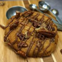 Turtle Cookie · Toll House chocolate chip cookie with pecans topping, chocolate and caramel drizzle. Mouthwa...