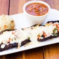 Steak Tampiquena · Large slab of beef skirt steak, pico de gallo, monterey cheese and served with flour tortill...