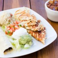 Laredo Combo · Grilled chicken quesadillas, flour tortilla stuffed with beef fajita covered in queso blanco...