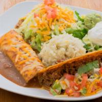 Plato Suarez · Cheese enchilada, bean and cheese tostada, crispy ground beef taco and served with sour crea...