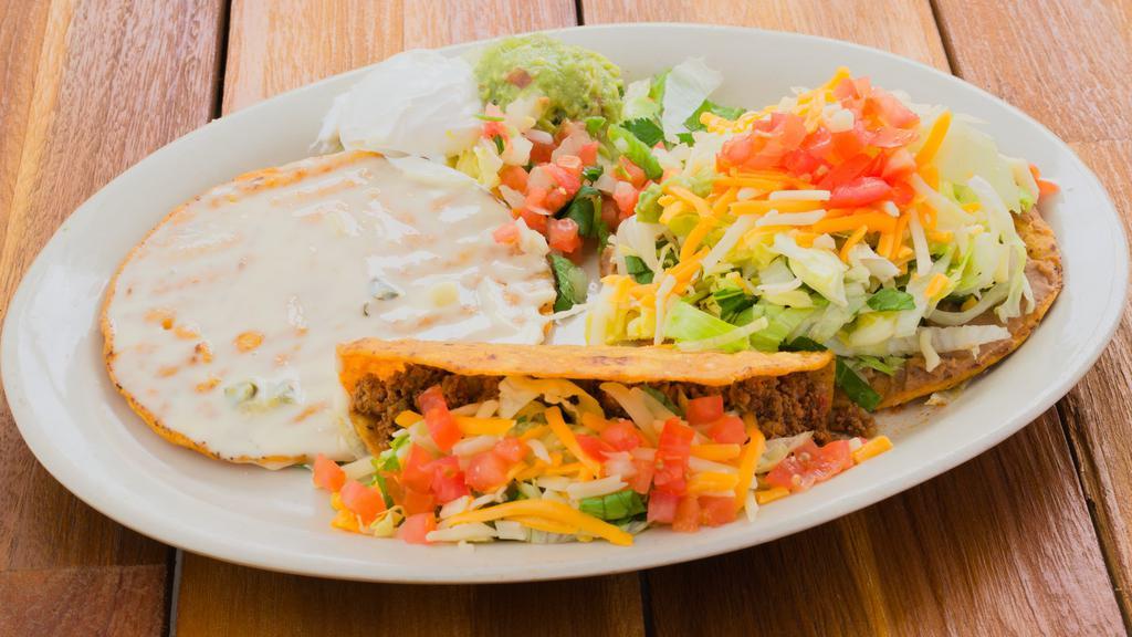 Combo Special · Crispy ground beef taco, bean and cheese tostada topped large queso chip, pico de gallo, guacamole and sour cream - not served with rice and beans.