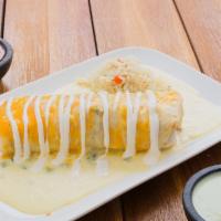 Veggie Burrito Con Queso · Large flour tortilla stuffed with sauteed vegetables, smothered with queso blanco and grated...