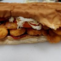 Fried Shrimp Poboy · Dressed with mayo, lettuce, tomato, and pickles on the best French bread.