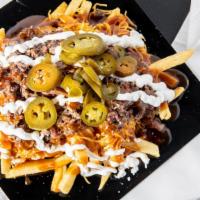Two  Meat Texas Nacho · Seasoned fries topped with your choice of two meats, shredded cheese,  peppers, sour cream, ...