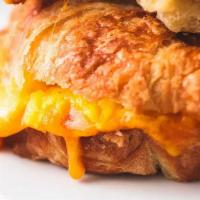 Breakfast Croissant · French Style Butter Croissant with 2 Scrambled Eggs and Cheddar Cheese. Add Cheese or  Sausa...