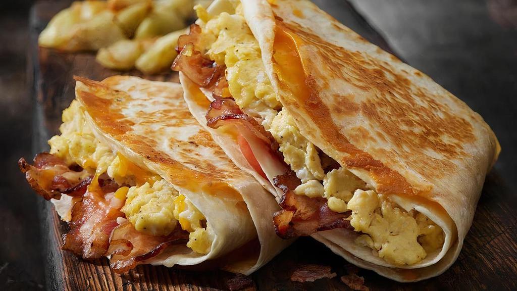 Breakfast Tacos · Flour Tortilla, One Scrambled Egg and Cheddar Cheese, with an Avocado Slice. Add Sausage, Bacon or Ham for 1.00