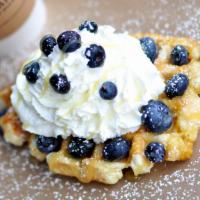 Southern Belle · Fresh blueberries, lemon curd, and housemade whipped cream on our golden Liege waffle.