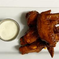 Wings · Wings are house brined and your choice
of Naked or Breaded.