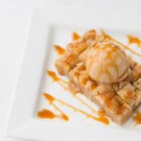 Traditional Bread Pudding · Traditional topped with homemade Jack Daniels caramel sauce and salted caramel gelato.
