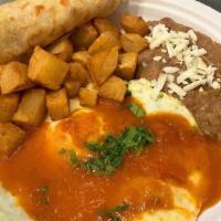 Huevos Rancheros · 2 over-medium eggs, smothered in house-made Ranchero sauce served with seasoned potatoes, re...