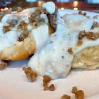 Biscuits & Gravy · An open-faced southern biscuit topped with creamy country gravy and sausage.