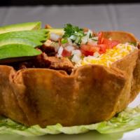 Taco Salad · Grilled Chicken, whole Pinto beans, Rice, Lettuce, Shredded Cheddar Cheese, Pico, Avocado, S...