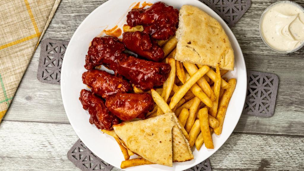 Bbq Hot Wings · 7 Wings Dipped in BBQ Sauce, French Fries, Pita bread, Ranch Sauce.