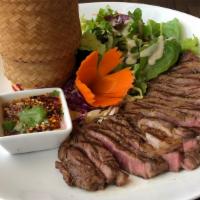 Crying Tiger · Gluten-free. 8 Oz. grilled rib-eye steak slices served with sticky rice and sun-dried chili ...