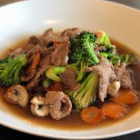Beef Broccoli · Stir-fried beef with broccoli, carrot, mushroom, and garlic.