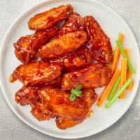 Buffalo Chicken Wings · Fresh chicken wings breaded, fried until golden brown, and tossed in buffalo sauce.