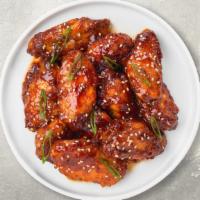 Teriyaki Sweet Chili Wings · Fresh chicken wings breaded, fried until golden brown, and tossed in teriyaki and sweet chil...