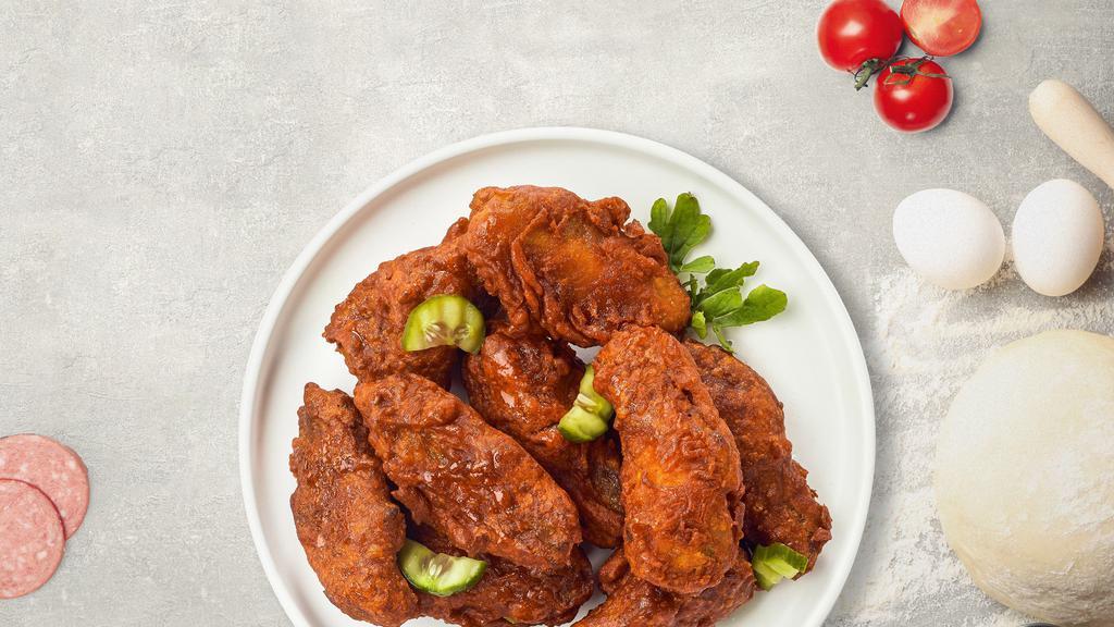 Hot Wings · Fresh chicken wings breaded, fried until golden brown, and tossed in hot sauce.
