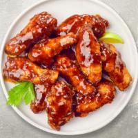 Bbq Chicken Wings · Fresh chicken wings breaded, fried until golden brown, and tossed in barbecue sauce.