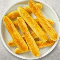 Cheese Breadsticks · Twelve sticks of crisp, baked cheese bread sticks from Italy. Served with ranch sauce.