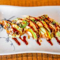 Monkey Brain · Light fried avocado with spicy tuna, cream cheese, with eel sauce, spicy mayo and green onio...