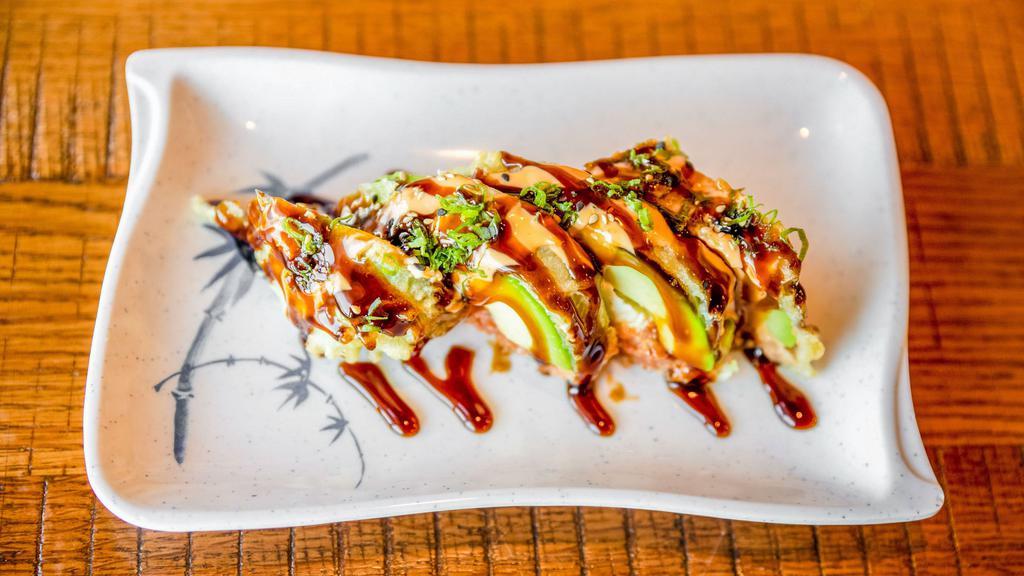 Monkey Brain · Light fried avocado with spicy tuna, cream cheese, with eel sauce, spicy mayo and green onion on top.