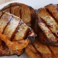 Big Moma'S Smothered Pork Chops & Onions · Baked potato, smothered pork chops.