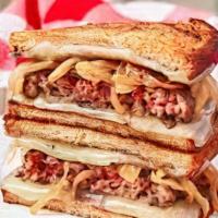 Patty'S Melt · Smashed patty, grilled onions, American cheese, parmesan toast, garnished with lettuce, and ...