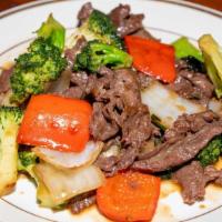 Broccoli Beef With White Rice · Tender beef stir fried with bell pepper, onion and broccoli coded with delicious oyster sauce.