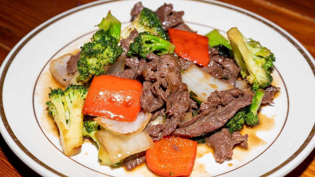 Broccoli Beef With White Rice · Tender beef stir fried with bell pepper, onion and broccoli coded with delicious oyster sauce.