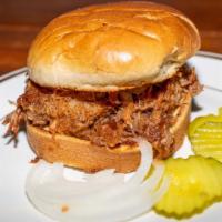 Shredded Pork Sandwich · Spread coleslaw, sweet baby ray's, onions, and pickles.